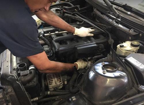 Technician working on vehicle